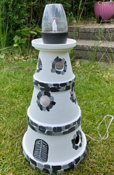 Ceramic lighthouse with solar light.
