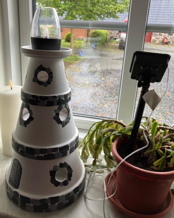 Ceramic lighthouse with solar light.