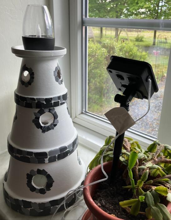 Ceramic lighthouse with solar light.